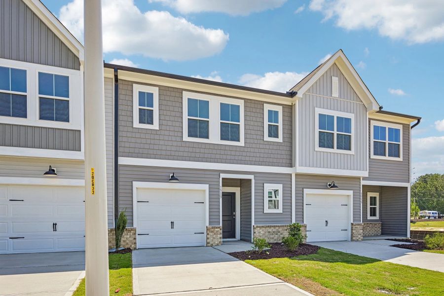 Front exterior of a new home in Towns at The Point, Rolesville, NC, highlighting curb appeal (Image 19).