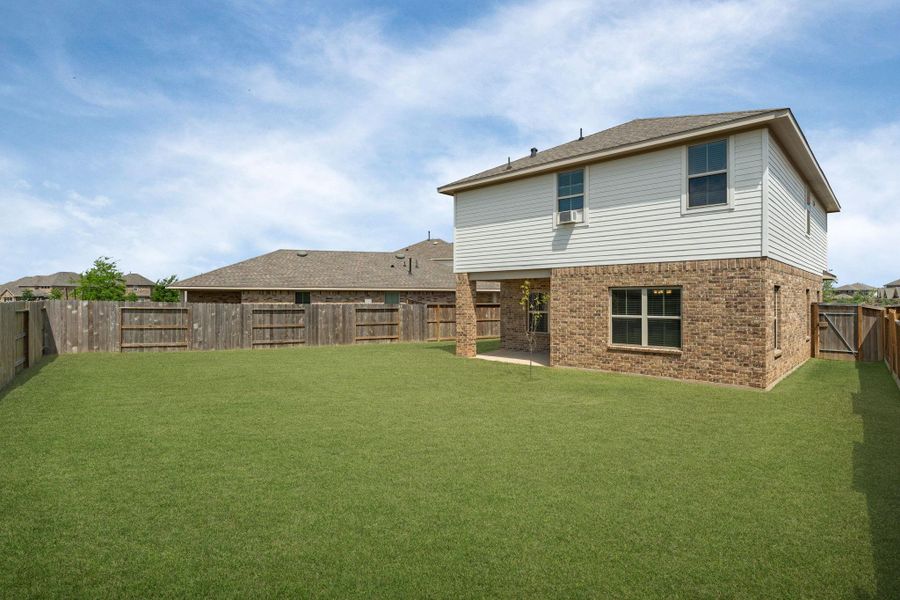 Exterior details and patio area of a home in Sunterra, Katy (Image 24).