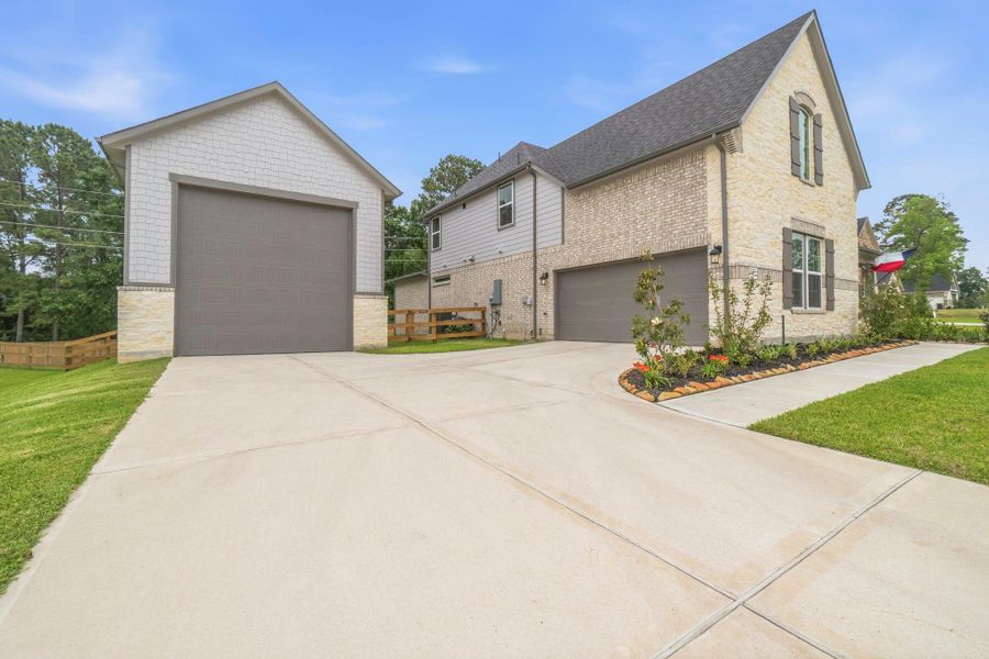 Front exterior of a new home in , Magnolia, TX, highlighting curb appeal (Image 22).