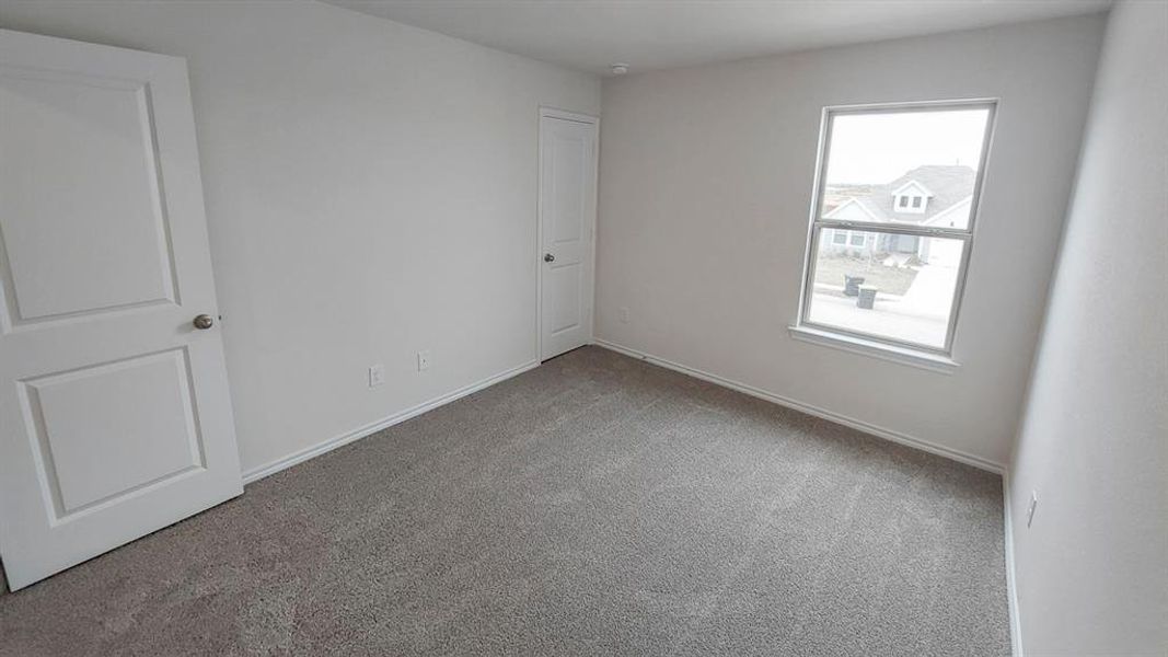 Unfurnished room featuring carpet and baseboards Unfurnished room featuring carpet and baseboards