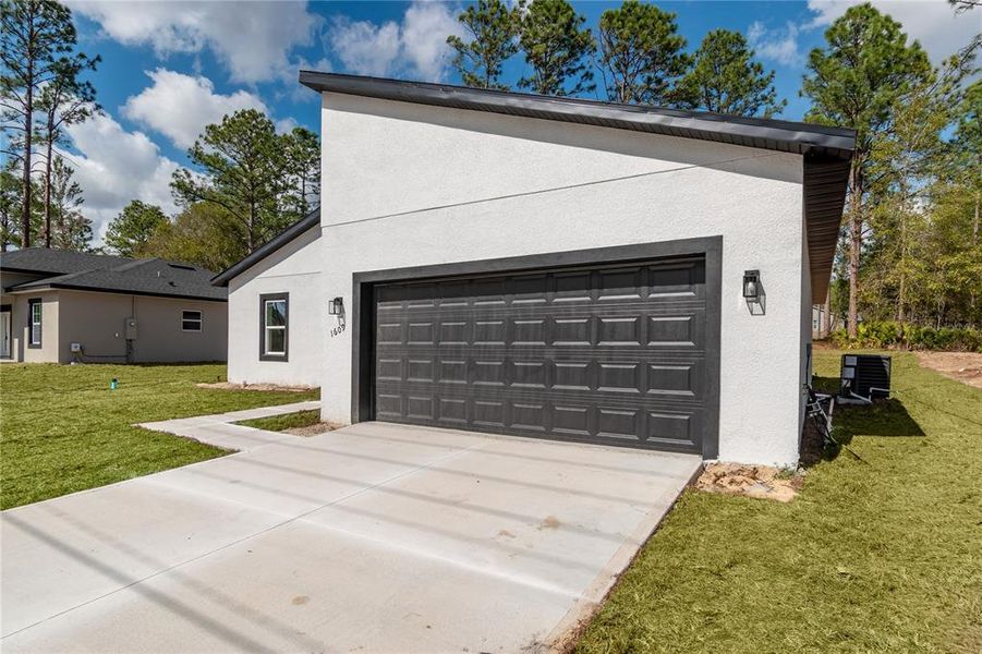 Front exterior of a new home in , Citrus Springs, FL, highlighting curb appeal (Image 30). Front exterior of a new home in , Citrus Springs, FL, highlighting curb appeal (Image 30).