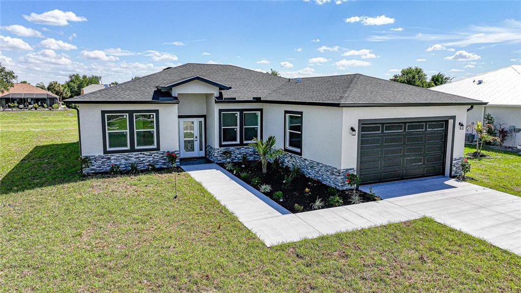 Front exterior of a new home in , Punta Gorda, FL, highlighting curb appeal (Image 23).