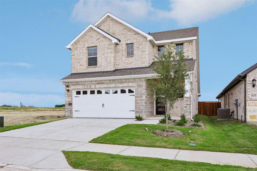 Front exterior of a new home in Parks at Foster Crossing - Spring Series, Anna, TX, highlighting curb appeal (Image 2). Front exterior of a new home in Parks at Foster Crossing - Spring Series, Anna, TX, highlighting curb appeal (Image 2).