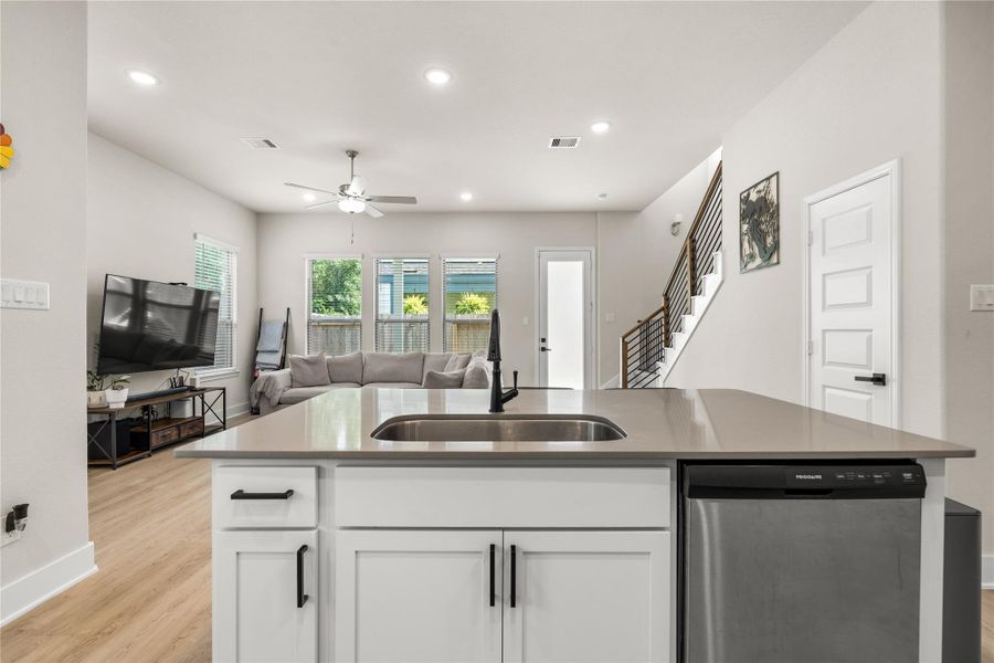 From the kitchen island, the home's most important spaces remain within view, creating a layout that feels connected, practical, and well-suited for everyday life.