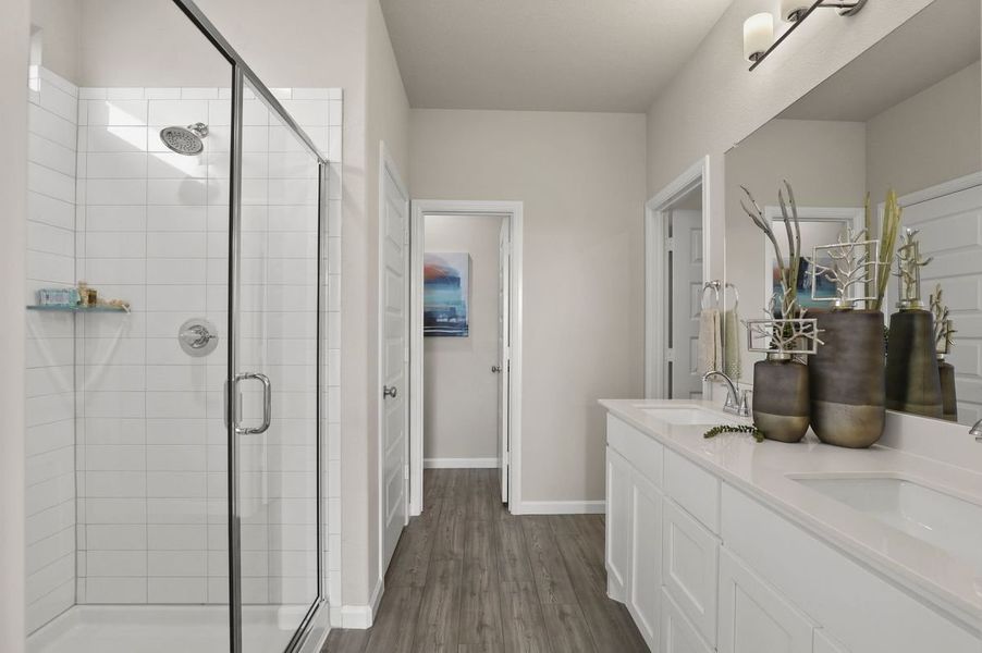 Primary Bathroom in the Masters home plan by Trophy Signature Homes – REPRESENTATIVE PHOTO