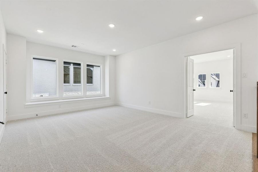 This light filled game room paired with a spacious media room offers the perfect place for endless family fun!