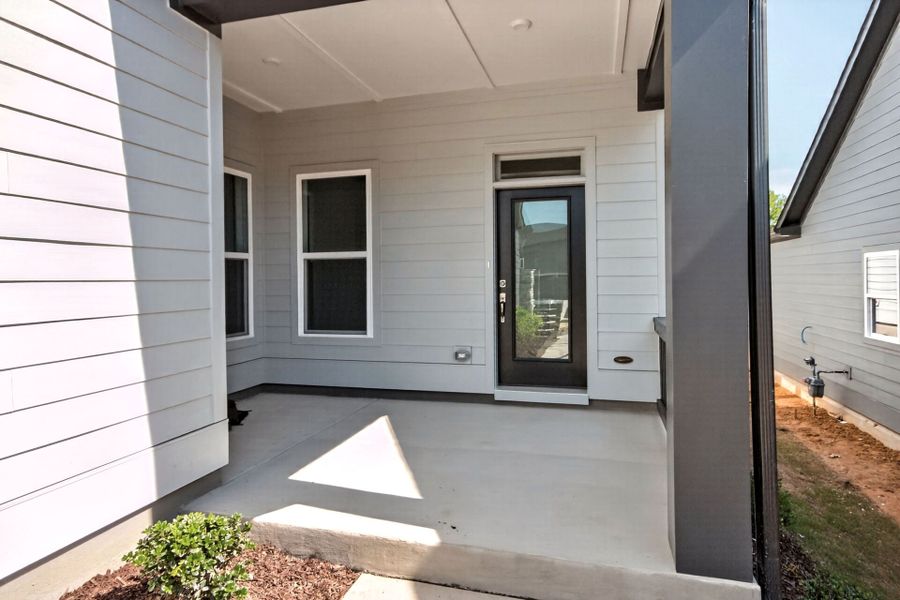 Exterior details and patio area of a home in Encore at Chatham Park – Villa Series, Pittsboro (Image 3).