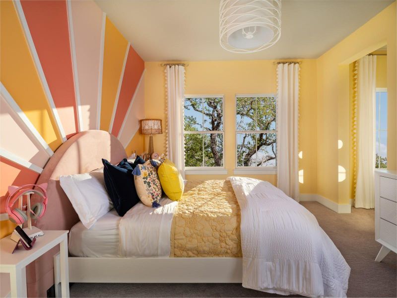 Carpeted bedroom featuring baseboards