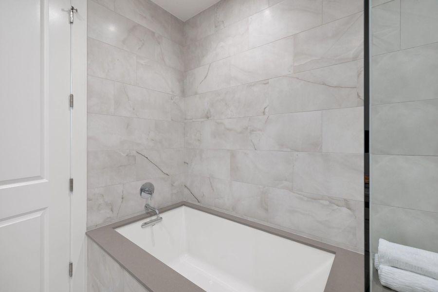 Separate tub in primary bathroom. Separate tub in primary bathroom.