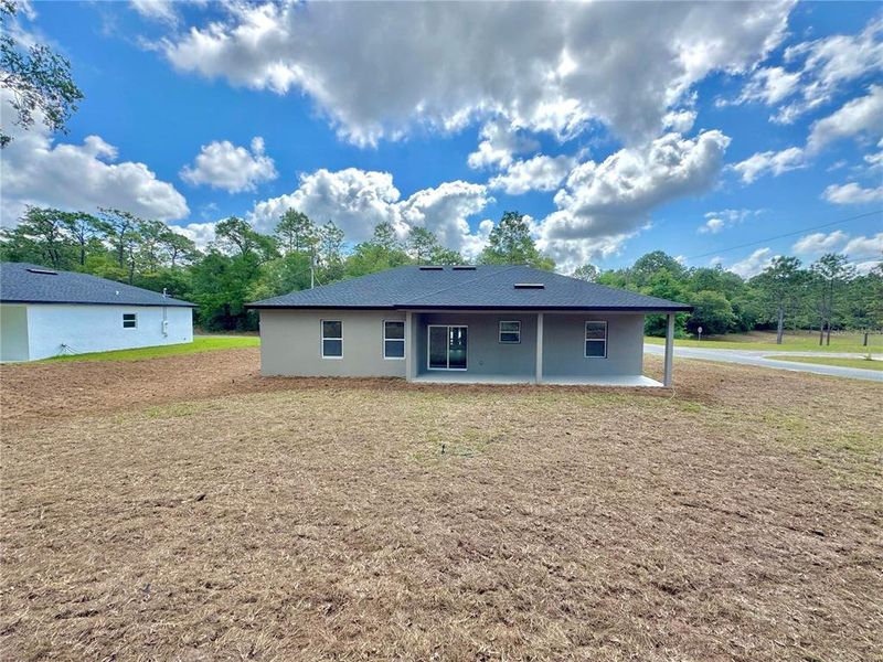 Front exterior of a new home in , Dunnellon, FL, highlighting curb appeal (Image 13).
