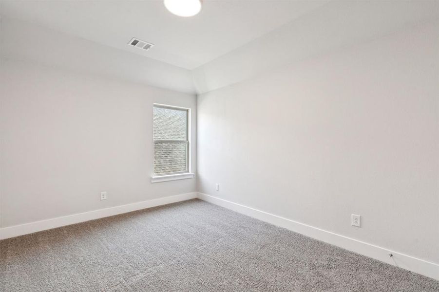 Empty room with baseboards and carpet flooring Empty room with baseboards and carpet flooring