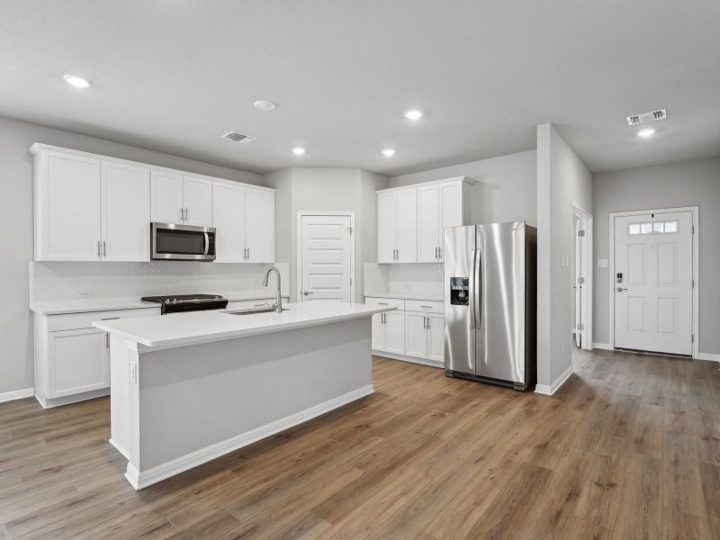 Furnished interior view inside a new home in Riverbend at Double Eagle - Boulevard Collection, Cedar Creek (Image 3).