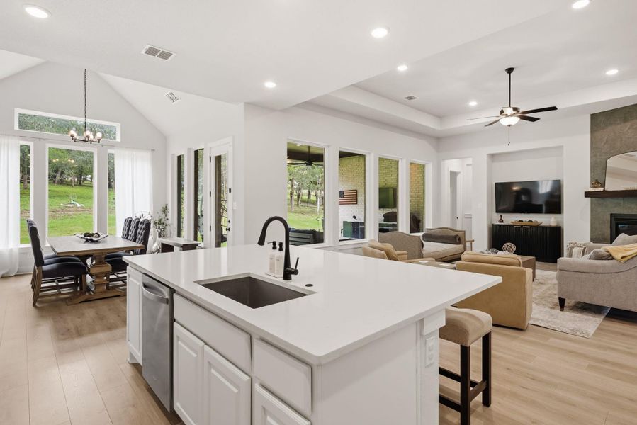 Overlooking the living room and the dining area, this open kitchen keeps you fully connected to the sights and sounds of the rest of the home