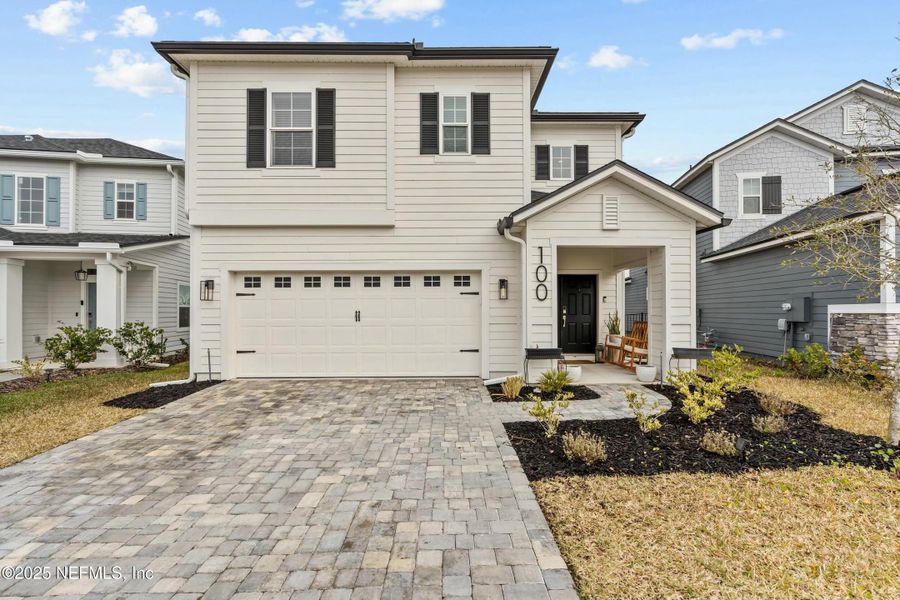 Front exterior of a new home in Silver Landing at SilverLeaf, St. Augustine, FL, highlighting curb appeal (Image 18).