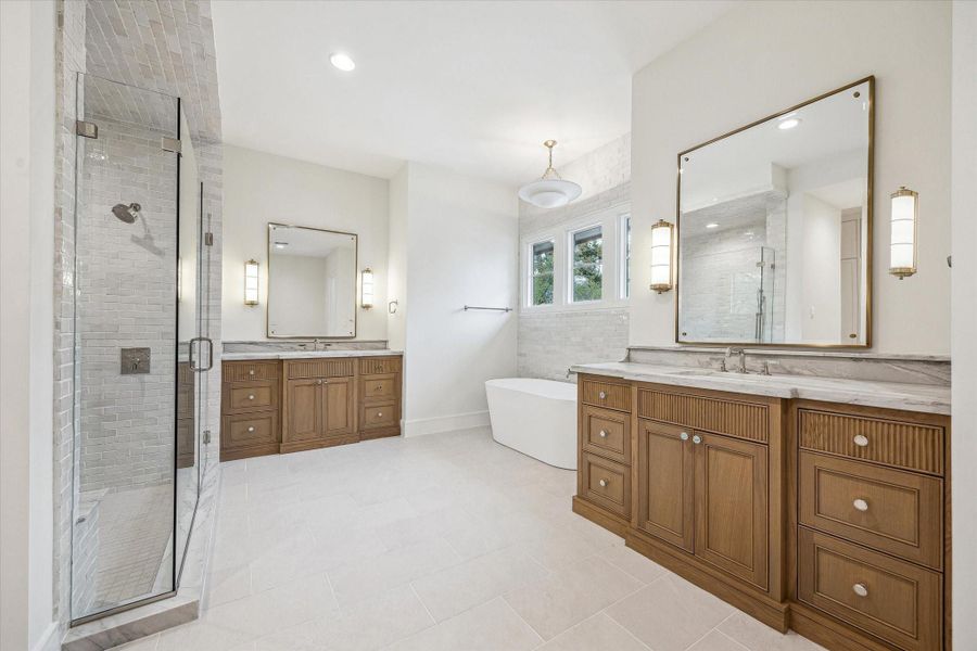 Spectacular Primary Bath with Oversized Glass shower, separate free standing tub, and two custom white oak vanity spaces! Spectacular Primary Bath with Oversized Glass shower, separate free standing tub, and two custom white oak vanity spaces!