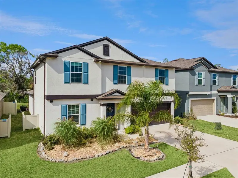 Front exterior of a new home in , Lakeland, FL, highlighting curb appeal (Image 22).