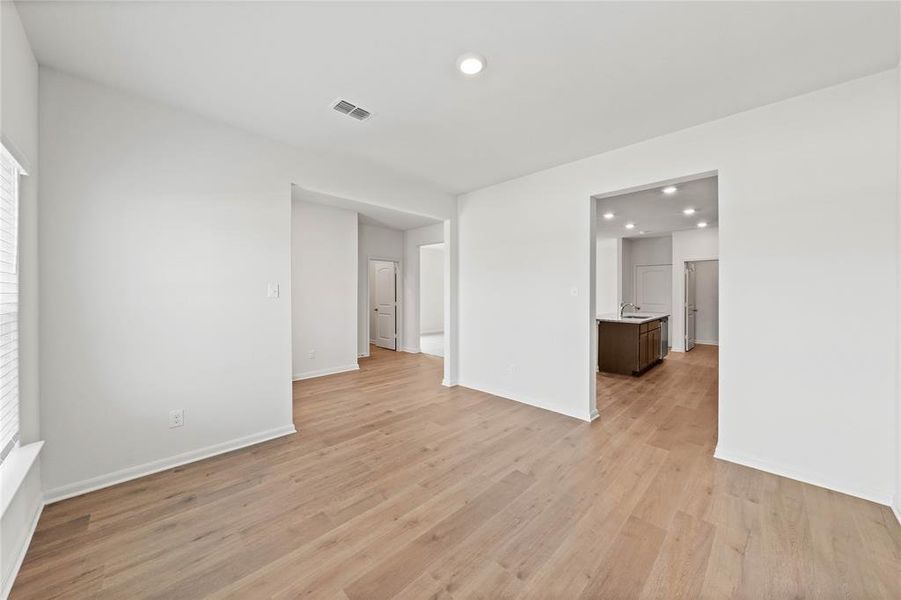 Unfurnished room with recessed lighting and light wood-type flooring