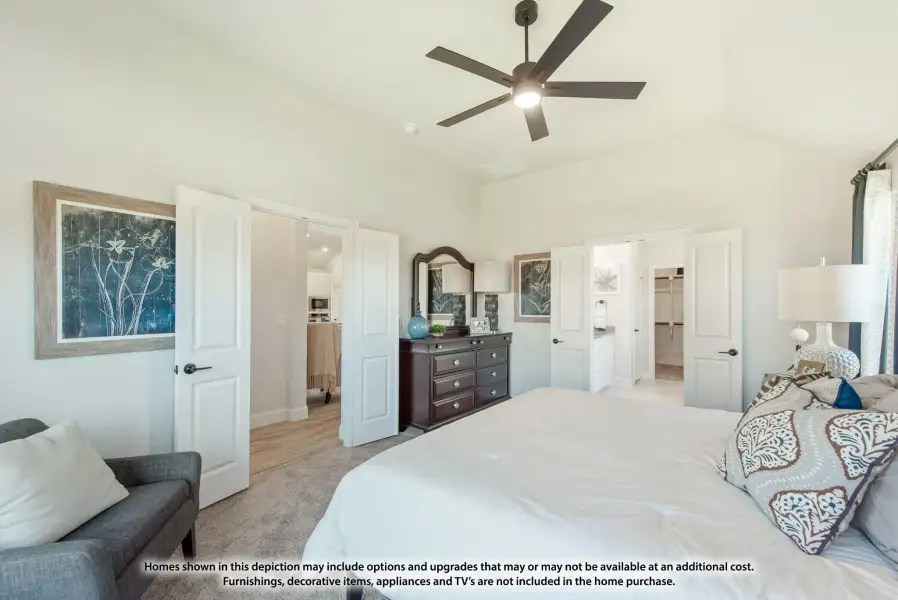 Master bedroom with vaulted ceiling, ceiling fan, and doors leading to ensuite bathroom and walk-in closet Master bedroom with vaulted ceiling, ceiling fan, and doors leading to ensuite bathroom and walk-in closet