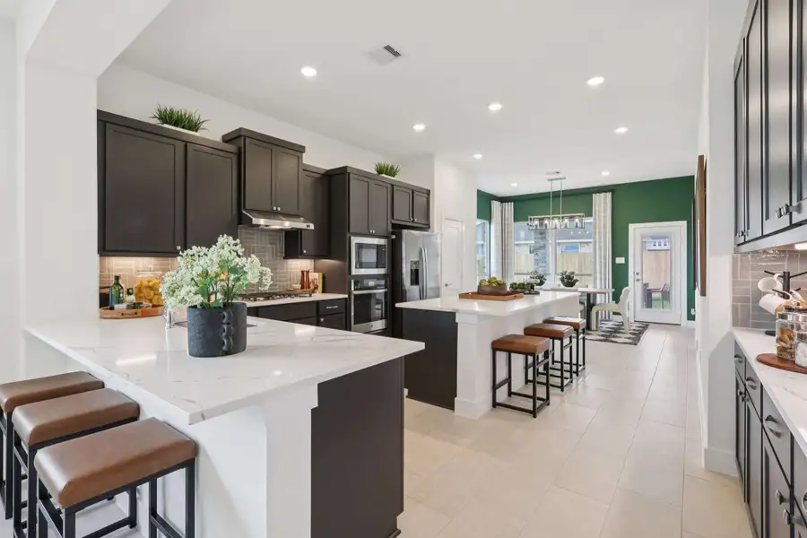 Furnished interior view inside a new home in Sunterra, Katy (Image 7).