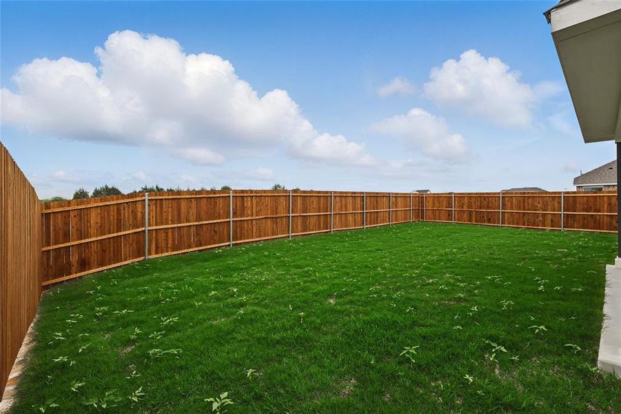 View of yard featuring a fenced backyard View of yard featuring a fenced backyard