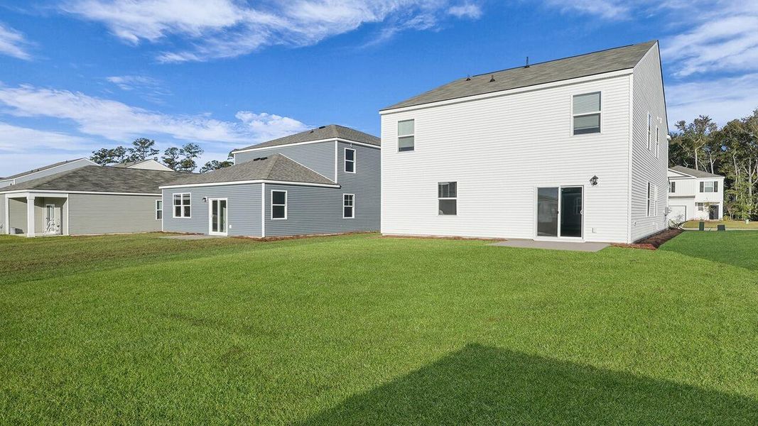 Exterior details and patio area of a home in Pine Hills at Cane Bay, Summerville (Image 22).