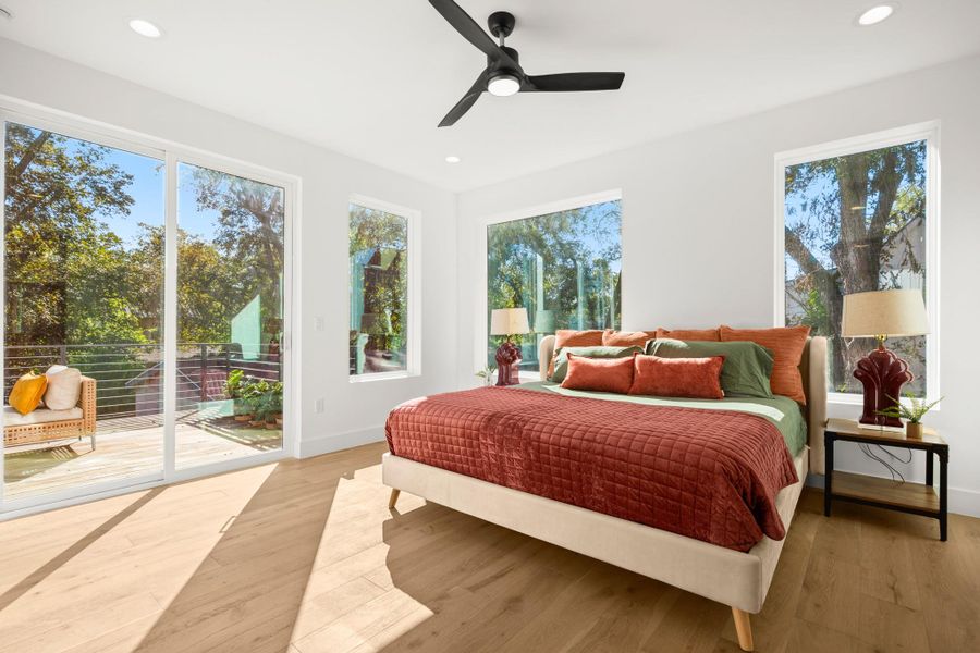 Bedroom with recessed lighting, wood finished floors, access to exterior, and a ceiling fan Bedroom with recessed lighting, wood finished floors, access to exterior, and a ceiling fan
