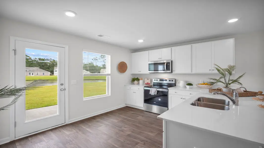 Representative furnished interior of a home built from the Curtis by D.R. Horton in Longleaf Village, Rincon (Image 7).
