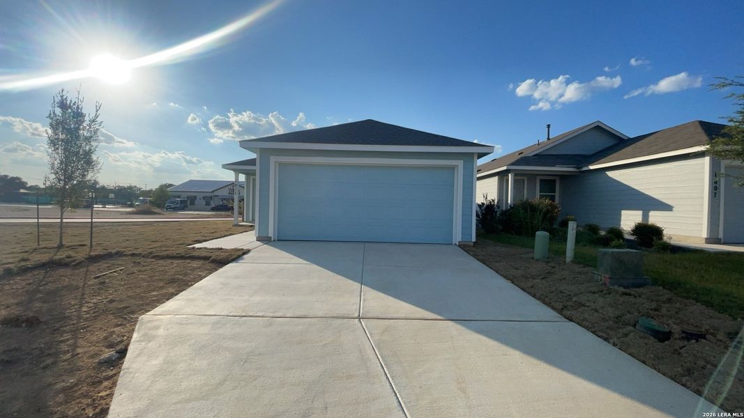 Front exterior of a new home in Landon Ridge, San Antonio, TX, highlighting curb appeal (Image 2).