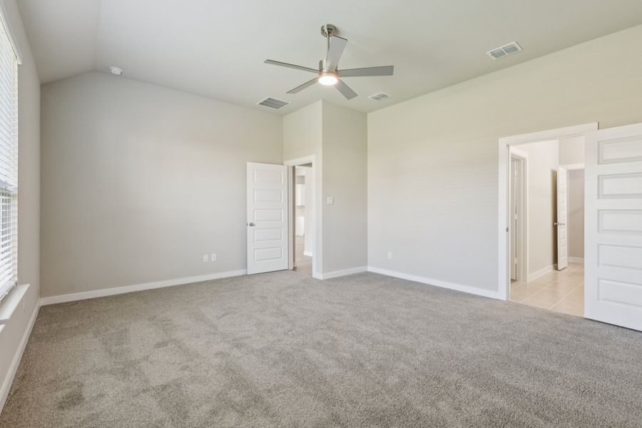 Primary Suite in the Stanley II home plan by Trophy Signature Homes – REPRESENTATIVE PHOTO