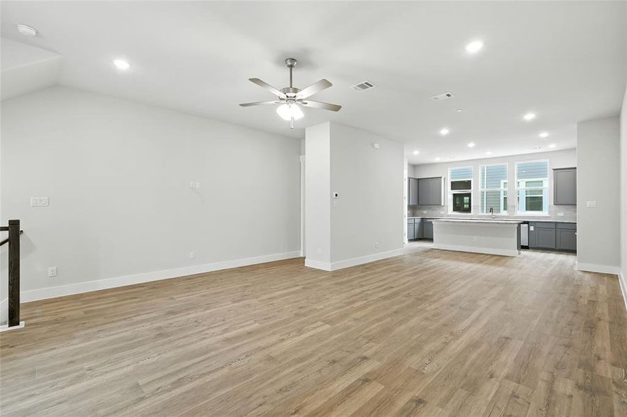 Unfurnished living room with recessed lighting, light wood finished floors, and a ceiling fan