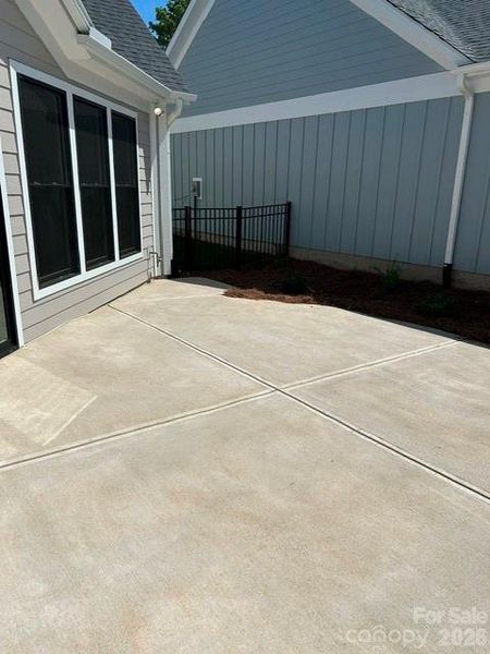 Exterior details and patio area of a home in The Courtyards at Hodges Farm, Charlotte (Image 3).