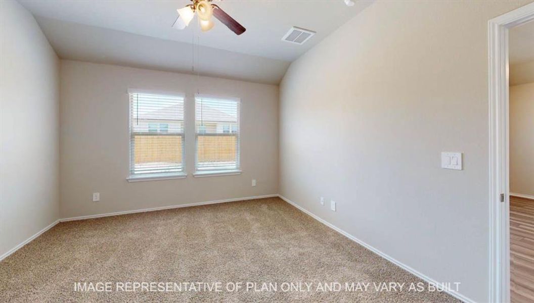 Spacious room featuring neutral carpeting, light-toned walls, and a ceiling fan with integrated lighting