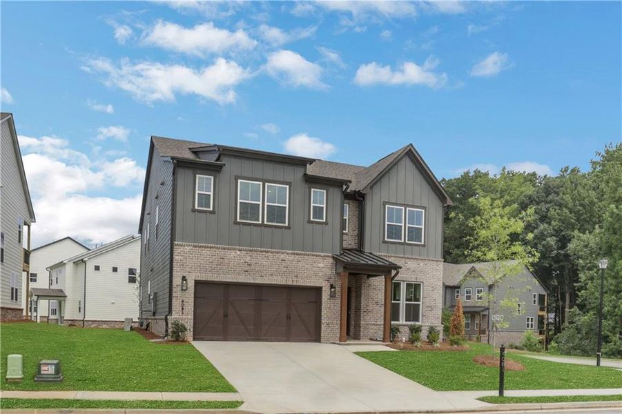 Front exterior of a new home in The Paddocks at Doc Hughes, Buford, GA, highlighting curb appeal (Image 25).