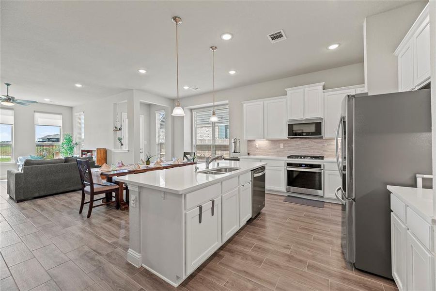 Say goodbye to cluttered countertops! The kitchen boasts ample storage, ensuring a clean and organized space. And just wait until you see the walk-in pantry – a storage enthusiast's dream come true!