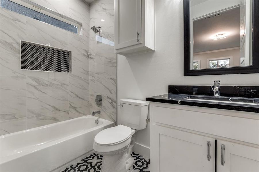 Upgraded bathroom, floor to celing tiles