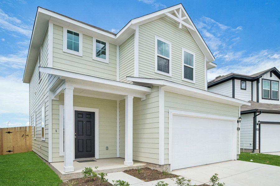 Front exterior of a new home in Cascade, Liberty Hill, TX, highlighting curb appeal (Image 20). Front exterior of a new home in Cascade, Liberty Hill, TX, highlighting curb appeal (Image 20).