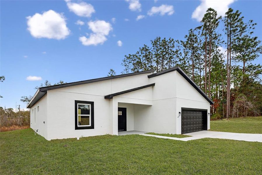 Front exterior of a new home in , Ocala, FL, highlighting curb appeal (Image 21).