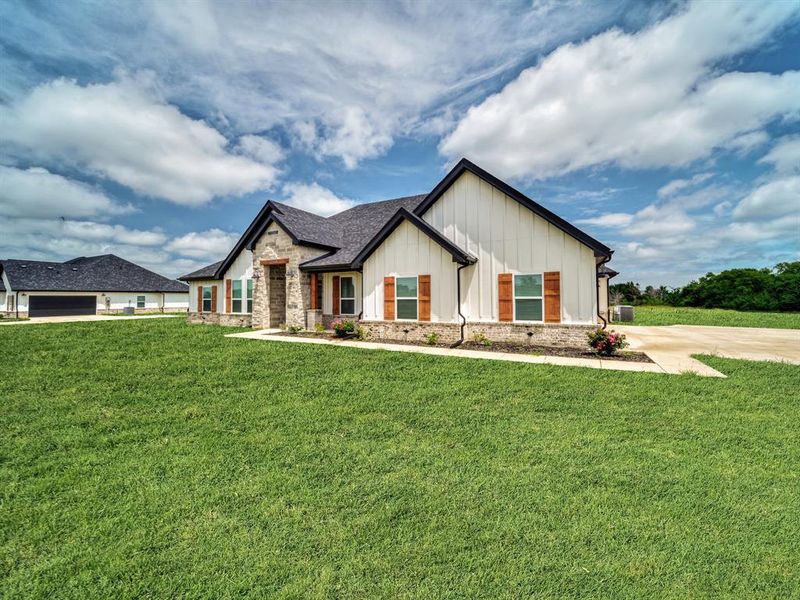 Front exterior of a new home in , Celeste, TX, highlighting curb appeal (Image 20).