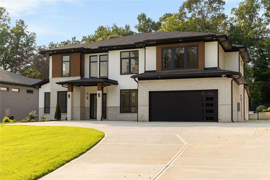 Front exterior of a new home in , Sugar Hill, GA, highlighting curb appeal (Image 35). Front exterior of a new home in , Sugar Hill, GA, highlighting curb appeal (Image 35).