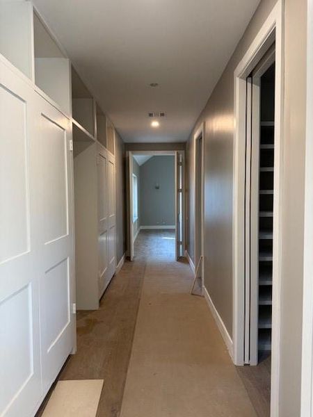 Primary Hallway with built-ins and full size mirror Primary Hallway with built-ins and full size mirror