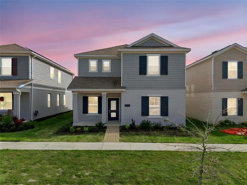 Front exterior of a new home in , St. Cloud, FL, highlighting curb appeal (Image 2). Front exterior of a new home in , St. Cloud, FL, highlighting curb appeal (Image 2).