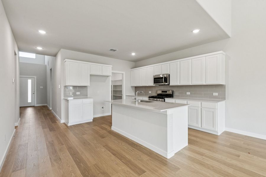 Kitchen in the Winters home plan by Trophy Signature Homes – REPRESENTATIVE PHOTO Kitchen in the Winters home plan by Trophy Signature Homes – REPRESENTATIVE PHOTO