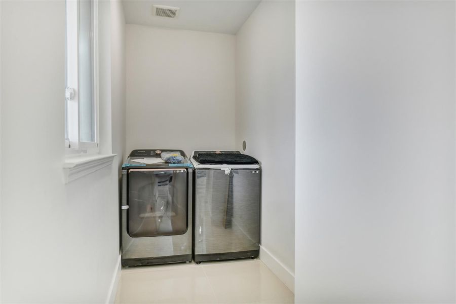 Everyday function stays neatly tucked away in the dedicated laundry closet. It is designed for full size appliances and keeps household tasks convenient without interrupting the living areas. Everyday function stays neatly tucked away in the dedicated laundry closet. It is designed for full size appliances and keeps household tasks convenient without interrupting the living areas.
