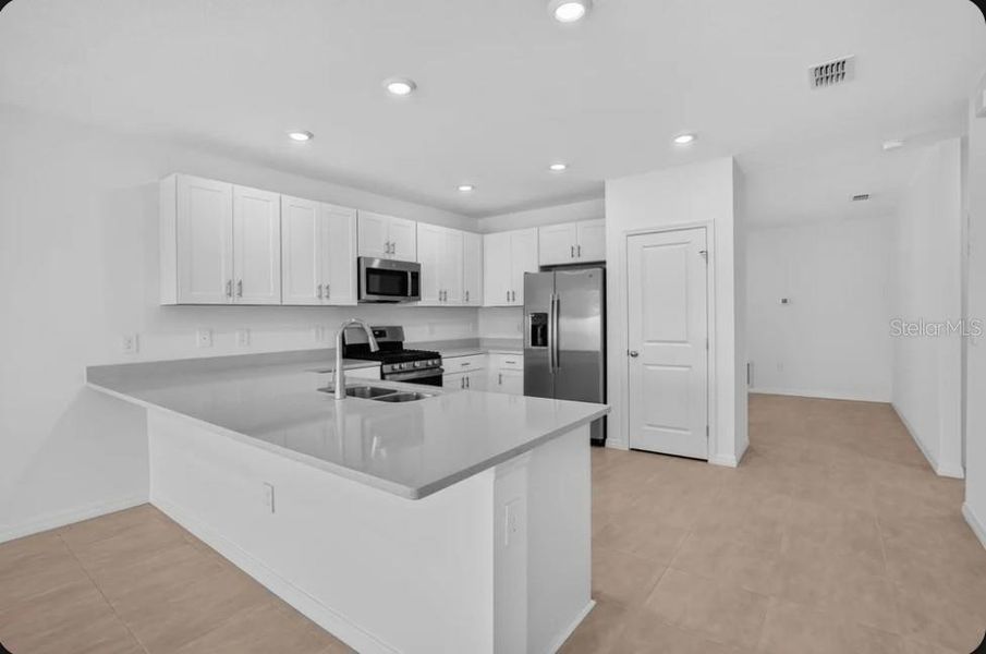 Furnished interior view inside a new home in Coasterra Community Group Page, Palmetto (Image 7).