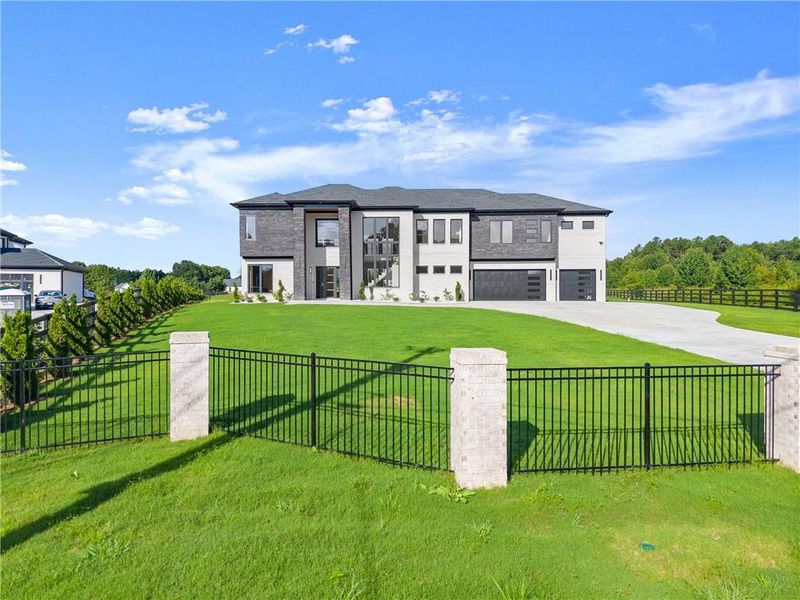 Front exterior of a new home in , Dacula, GA, highlighting curb appeal (Image 23).