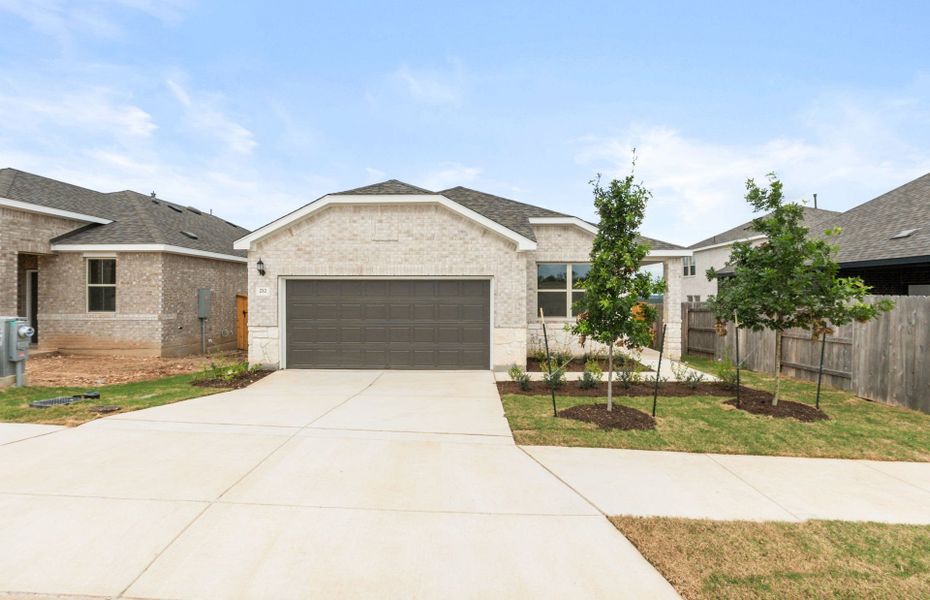 Front exterior of a new home in La Cima, San Marcos, TX, highlighting curb appeal (Image 21).