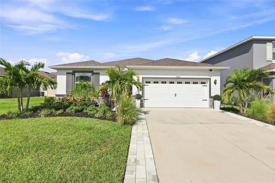 Front exterior of a new home in , Lakewood Ranch, FL, highlighting curb appeal (Image 23).