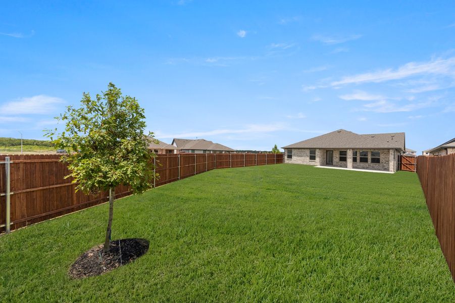 Front exterior of a new home in Northspur, Terrell, TX, highlighting curb appeal (Image 27). Front exterior of a new home in Northspur, Terrell, TX, highlighting curb appeal (Image 27).