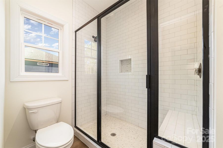 Primary bathroom- Tiled walk-in shower