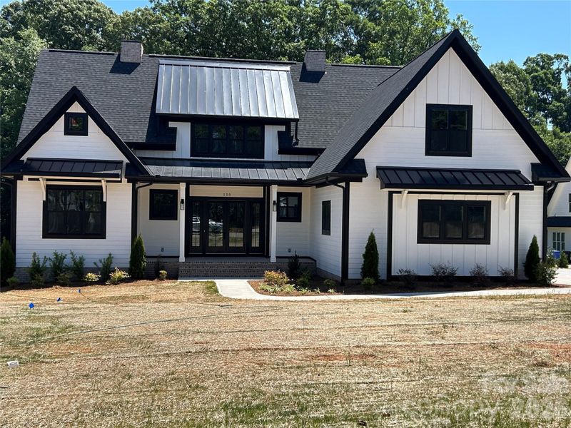 Front exterior of a new home in , Mooresville, NC, highlighting curb appeal (Image 1). Front exterior of a new home in , Mooresville, NC, highlighting curb appeal (Image 1).